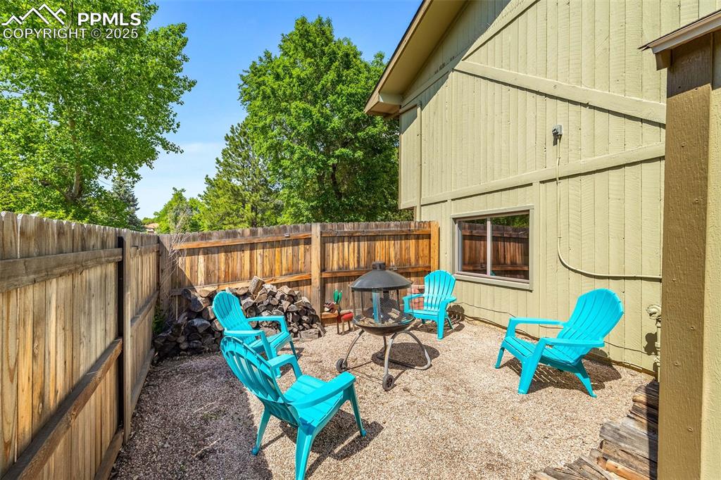 Image 36 of 47: View of fenced backyard