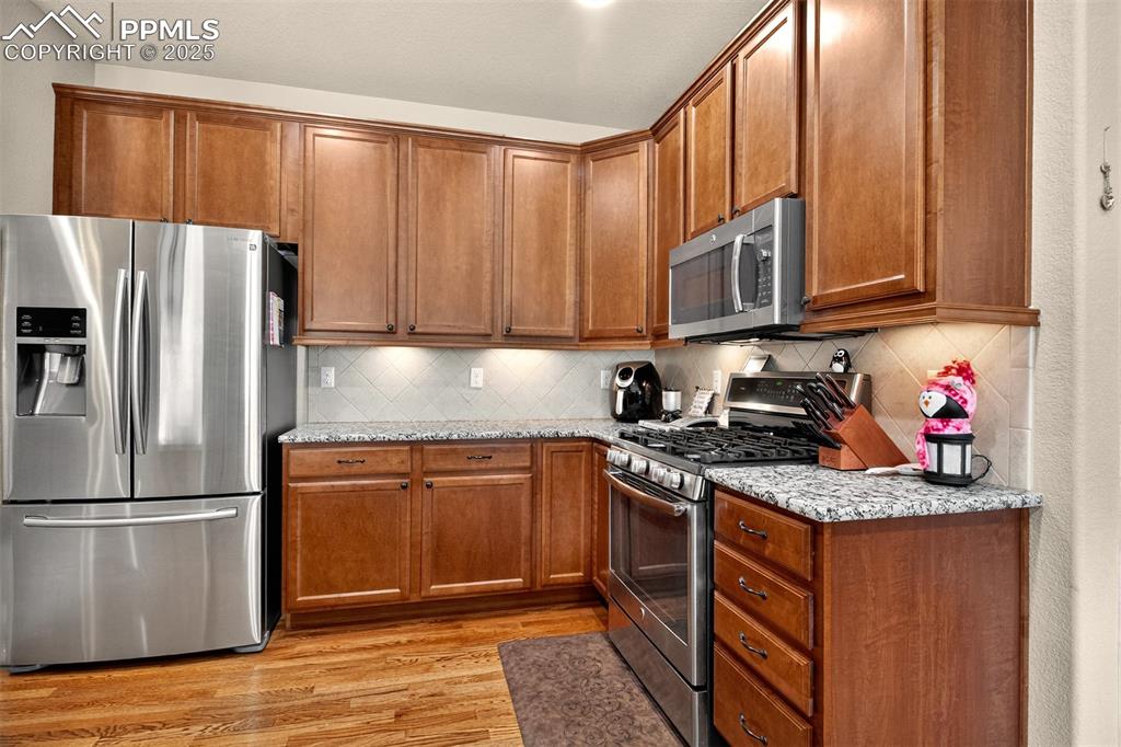 Image 10 of 48: Stainless steel appliances with a gas stove!