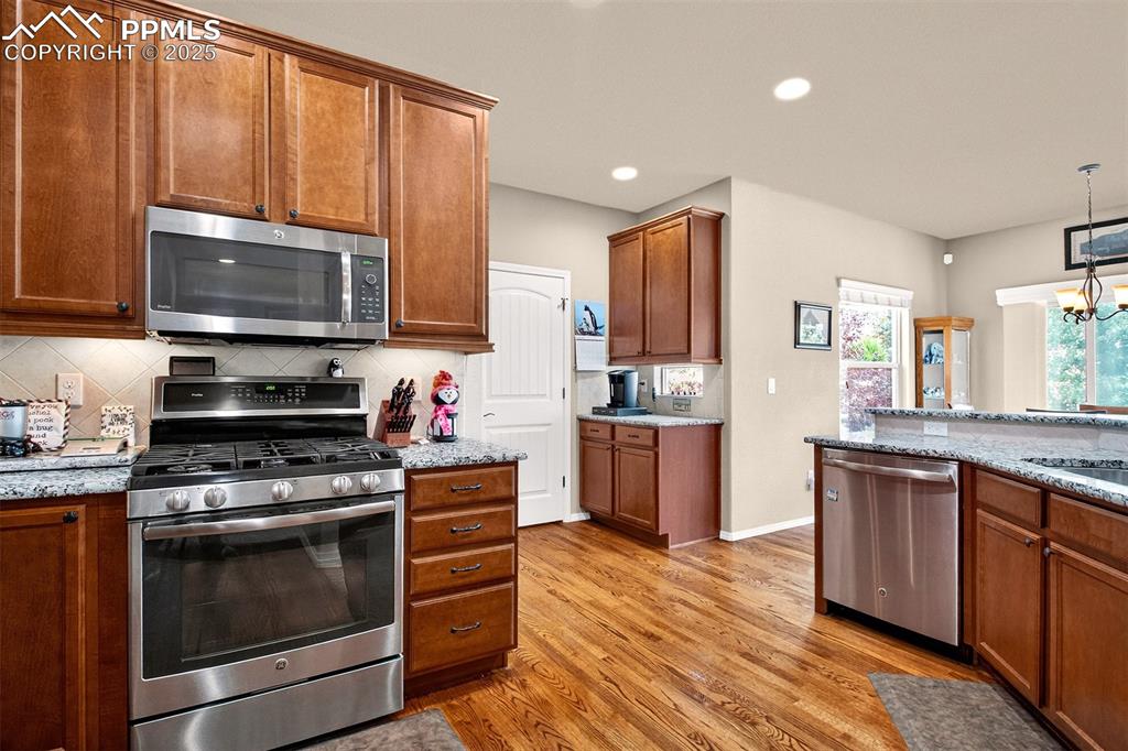 Image 11 of 48: There is a pantry along with all these cabinets.