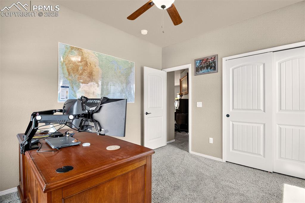 Image 18 of 48: Secondary bedroom or office on the main level. 
