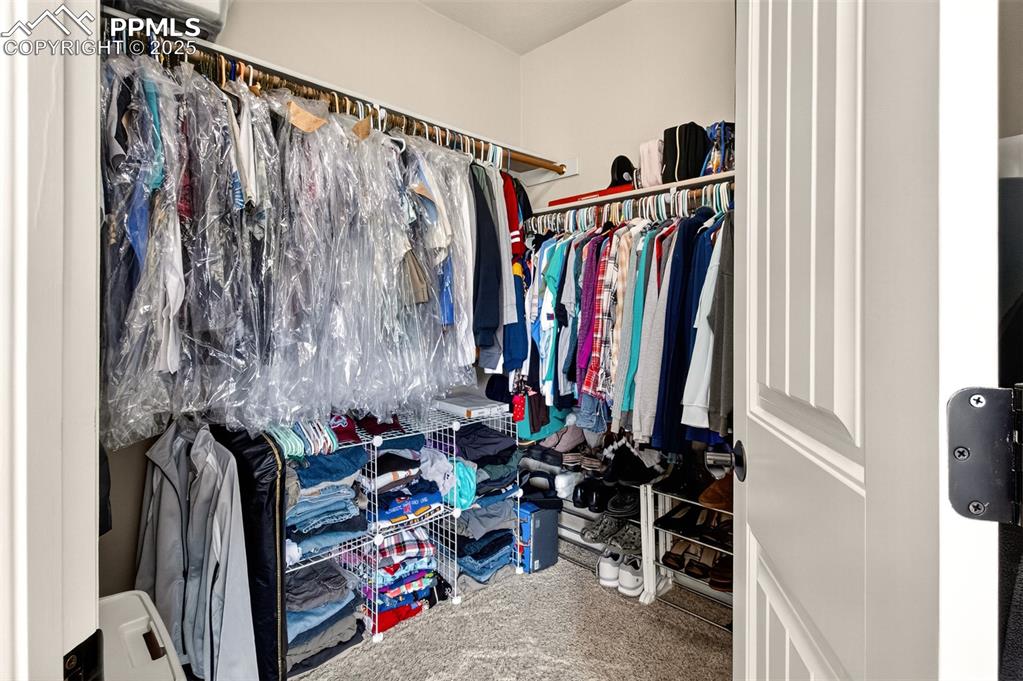 Image 24 of 48: Master bedroom walk in closet. 