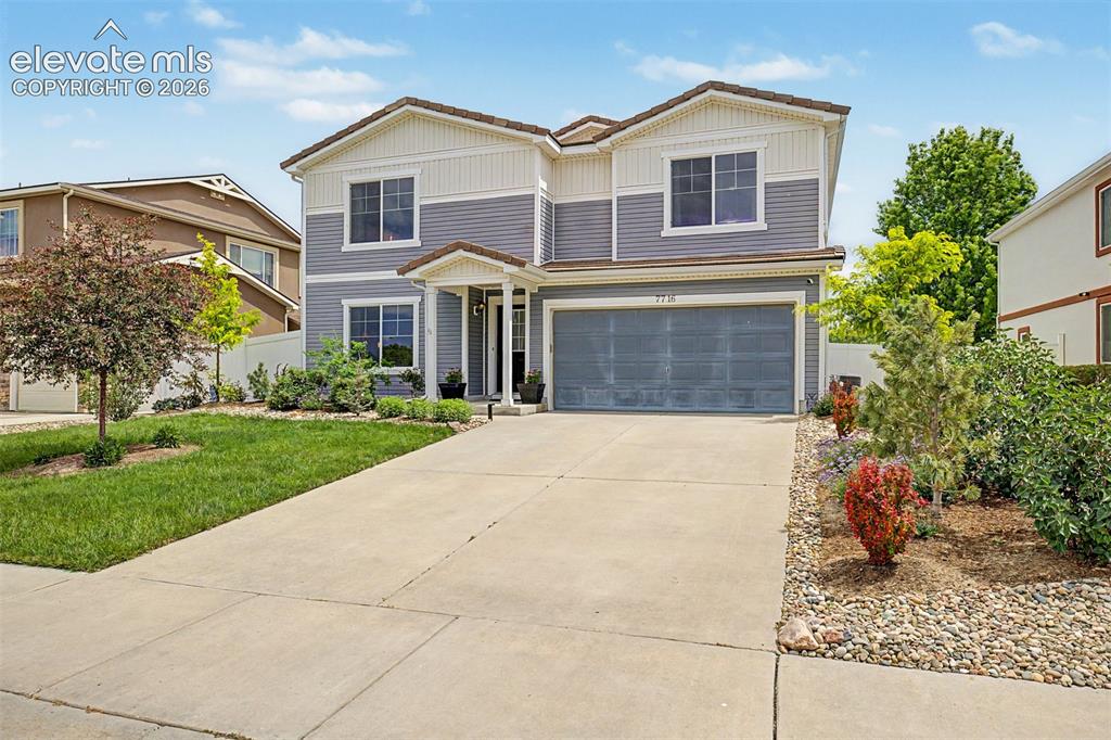 Image 1 of 43: A charming two-story home with manicured landscaping creates an inviting fi