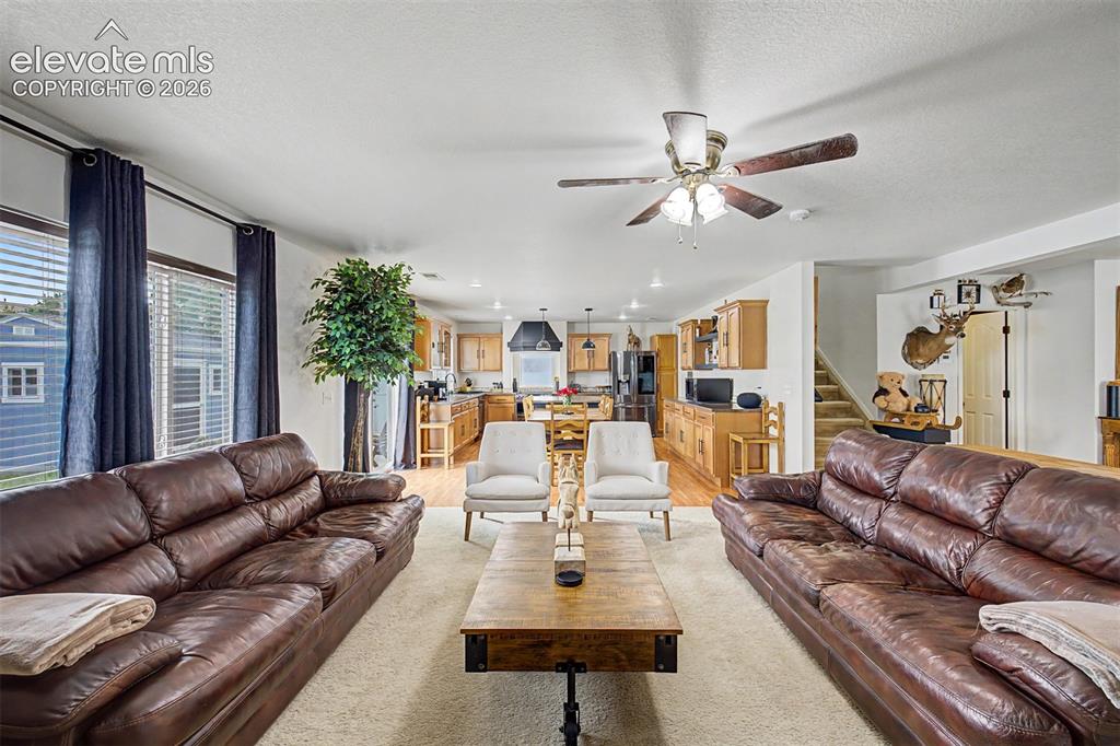 Image 10 of 43: The great room unfolds in impressive fashion, with the living area flowing