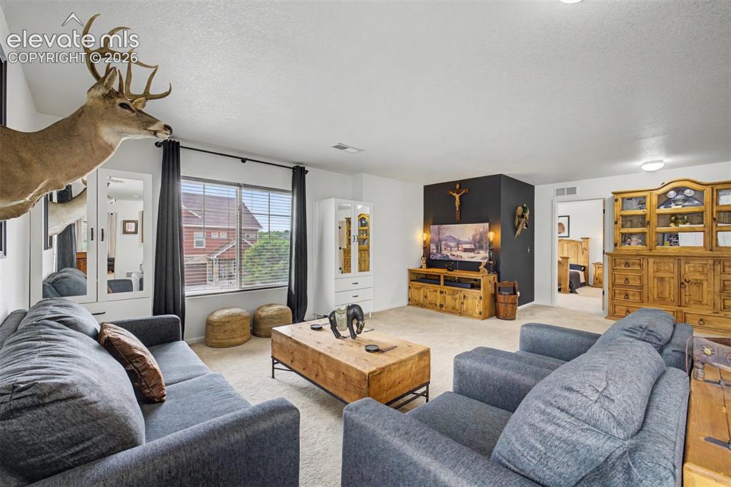 Image 18 of 43: This light-filled loft space with wide windows and generous square footage