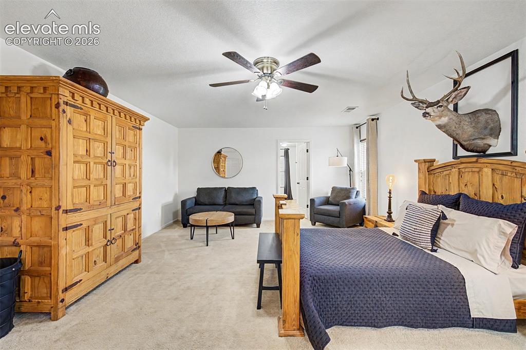 Image 21 of 43: The primary suite flows naturally toward a dedicated en suite, and its gene