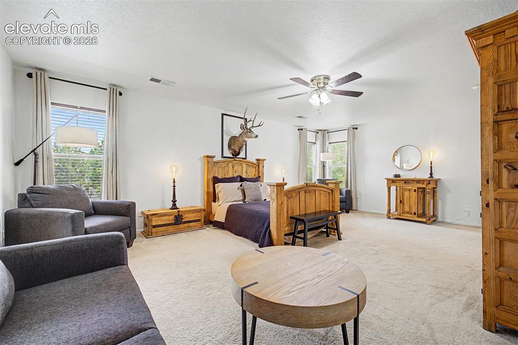 Image 23 of 43: The sheer size of this primary bedroom sets it apart — with room to spread