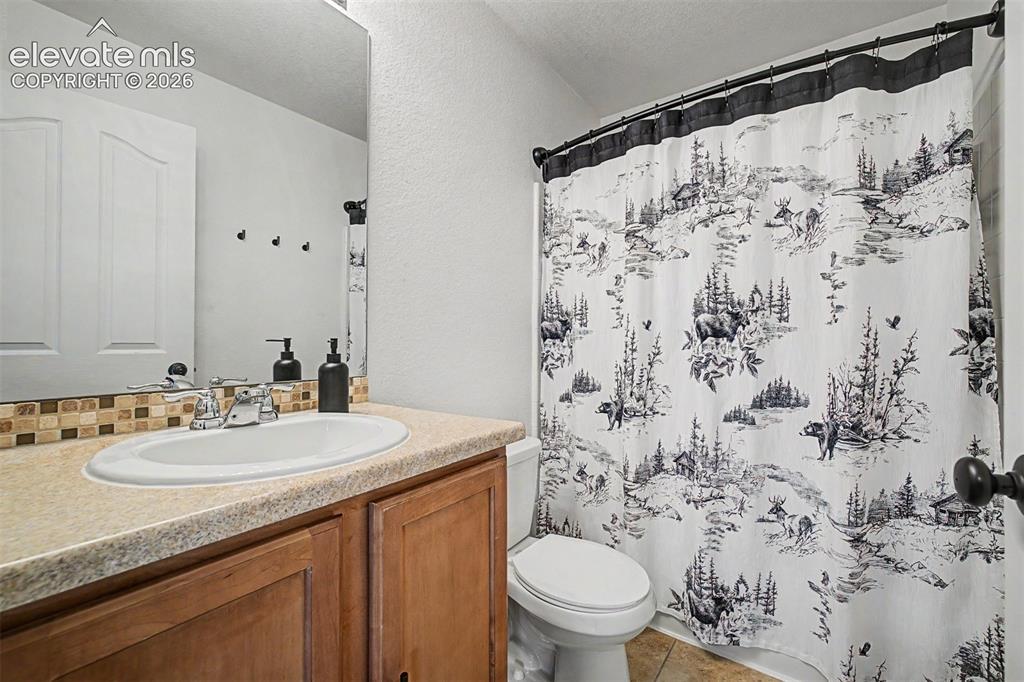 Image 34 of 43: This full secondary bathroom is clean, functional, and carries the home