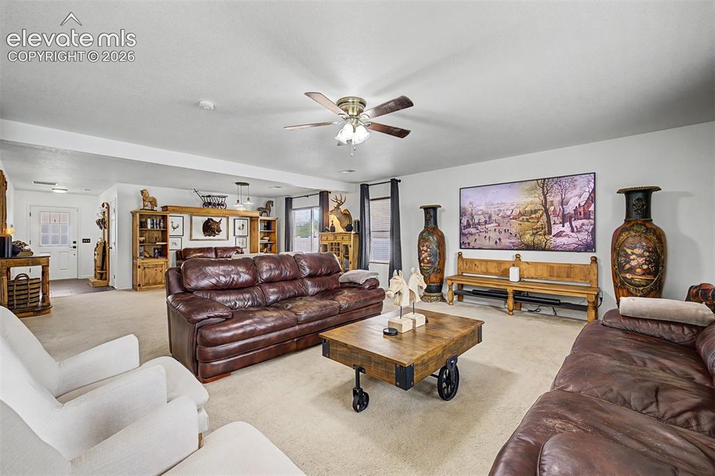 Image 9 of 43: A room that feels equally ready for movie nights and meaningful conversatio