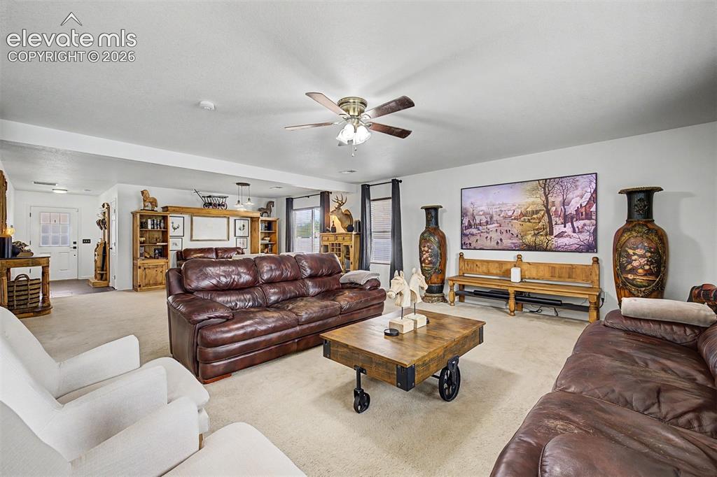 Image 9 of 43: A room that feels equally ready for movie nights and meaningful conversatio