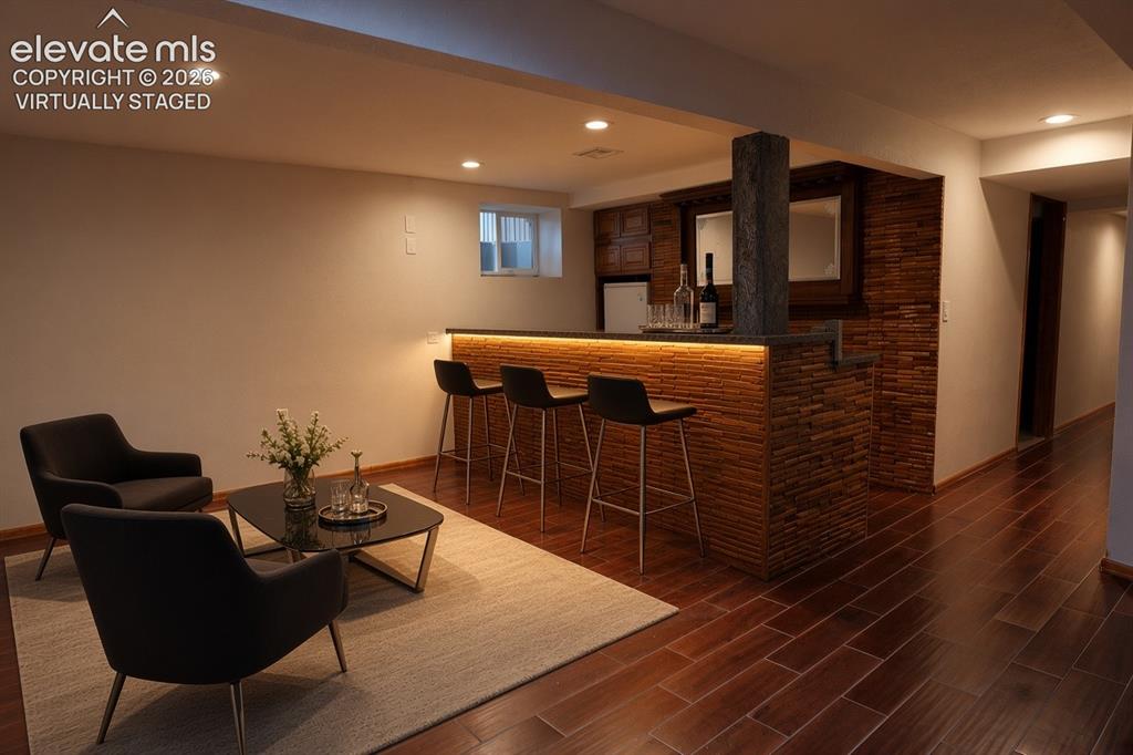 Image 49 of 49: virtually staged bar in the basement 