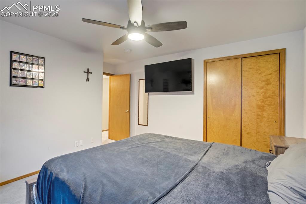 Image 39 of 50: Bedroom featuring a closet and a ceiling fan