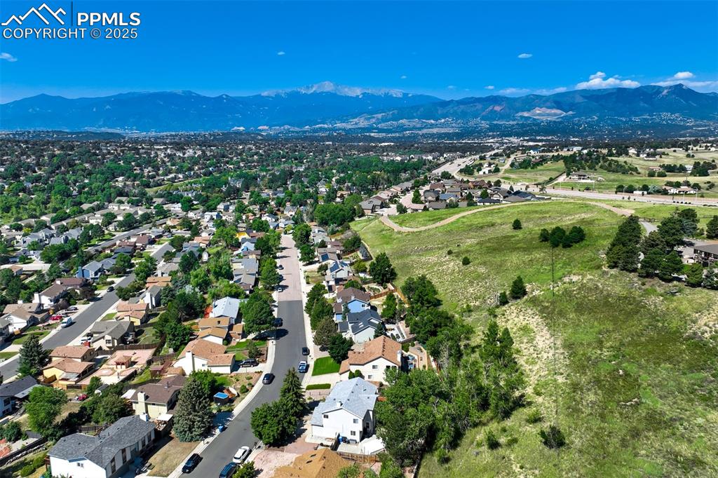 Image 48 of 50: Aerial view of residential area with mountains