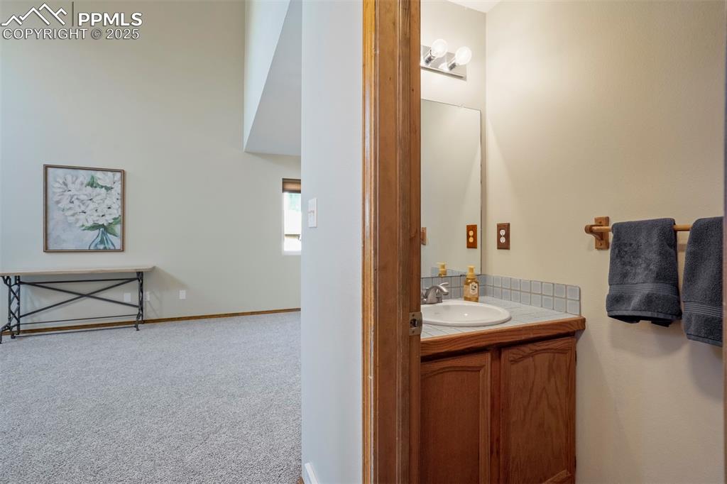 Image 9 of 50: Bathroom featuring vanity and baseboards