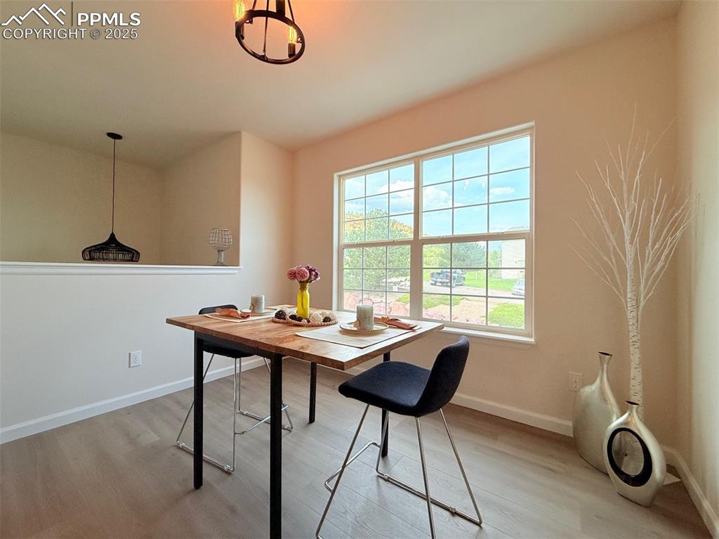 Image 18 of 44: Dining room with light wood-type flooring