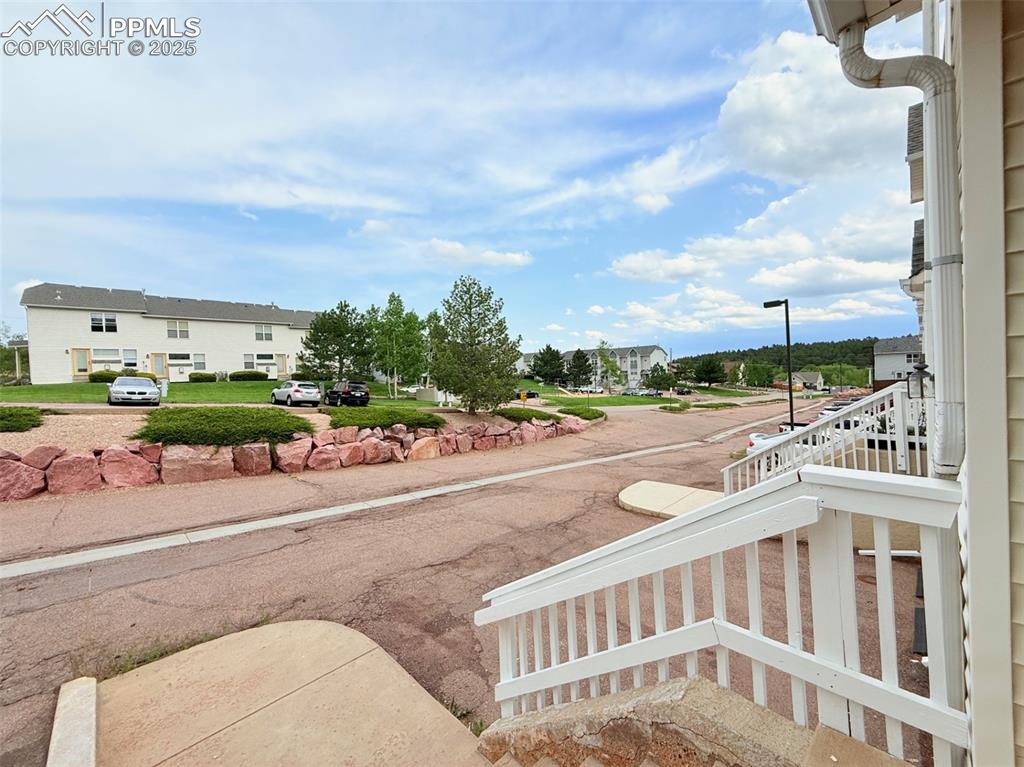 Image 2 of 44: View of yard with a balcony