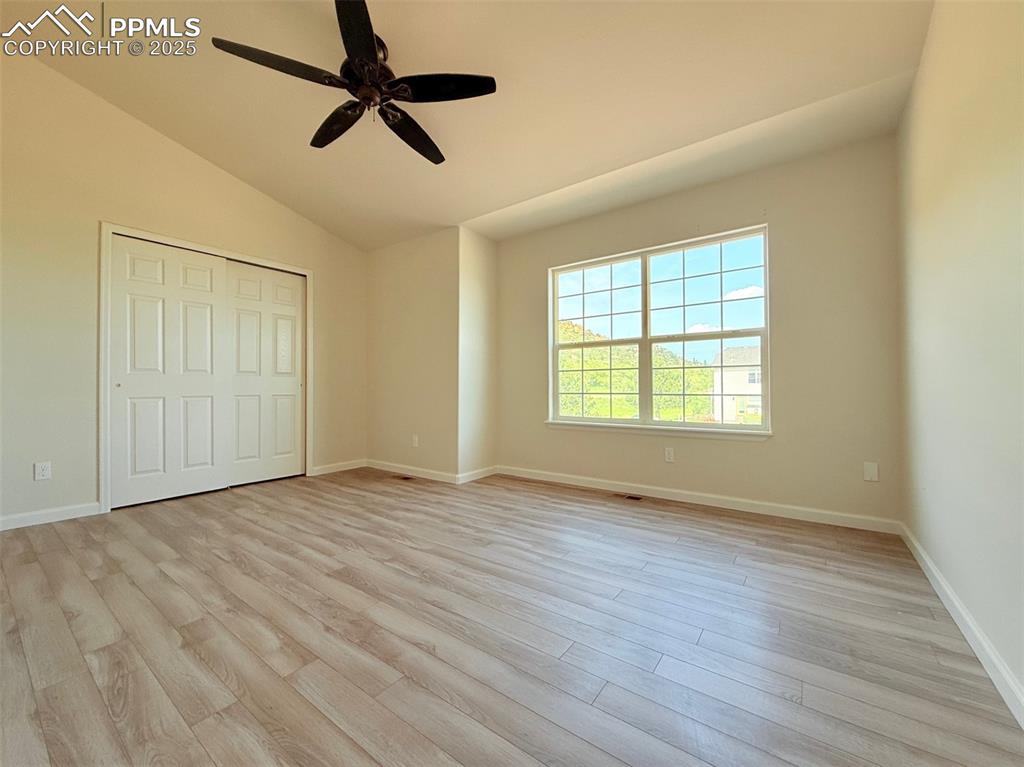 Image 23 of 44: Unfurnished bedroom featuring light wood finished floors, a ceiling fan, va
