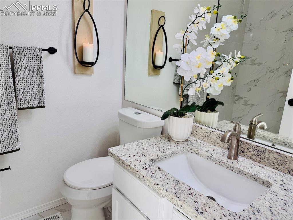 Image 28 of 38: Bathroom featuring vanity and toilet