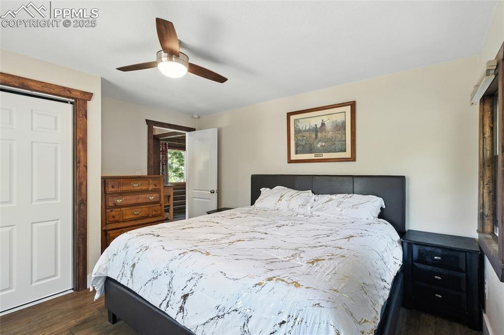 Image 30 of 43: Bedroom featuring dark wood finished floors, a closet, and ceiling fan