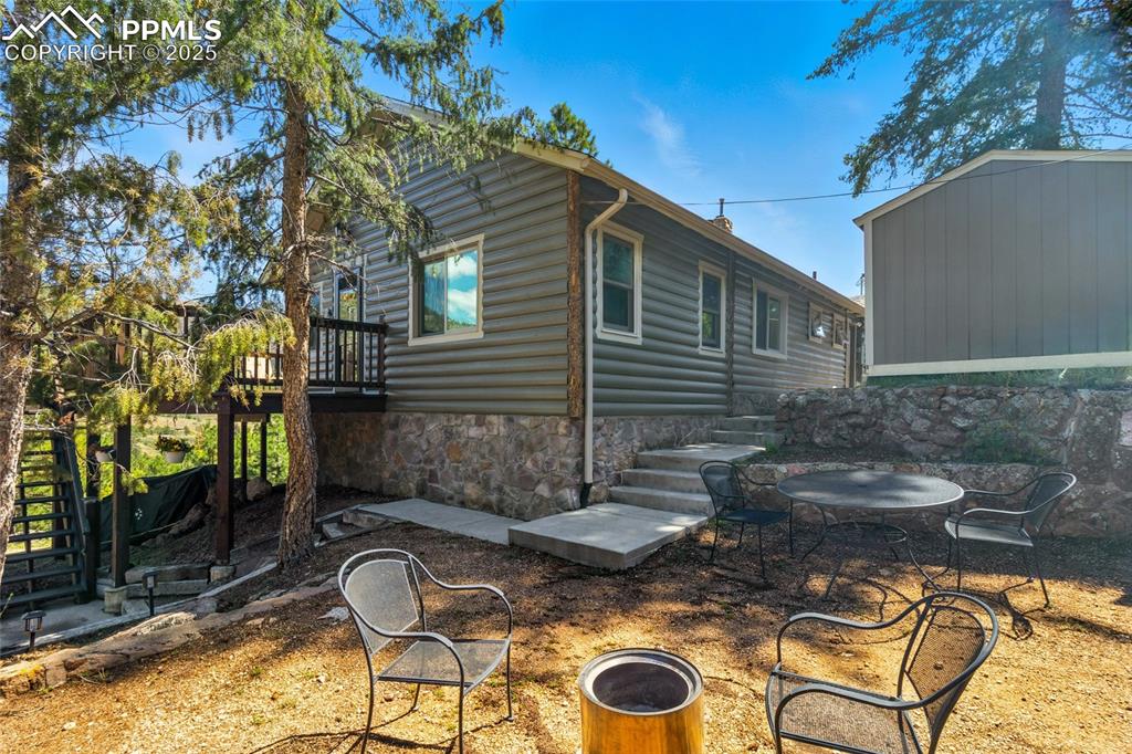 Image 34 of 43: View of patio featuring stairway