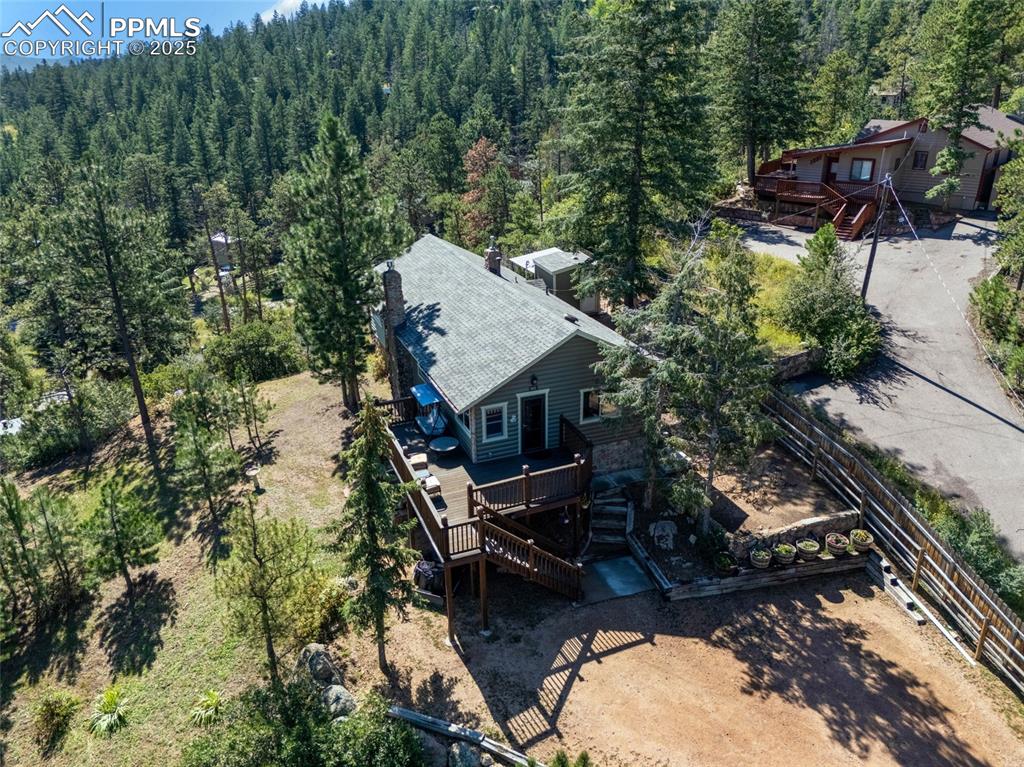 Image 5 of 43: View from above of property featuring a heavily wooded area