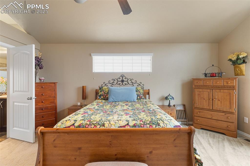 Image 21 of 50: Bedroom with ceiling fan and baseboards