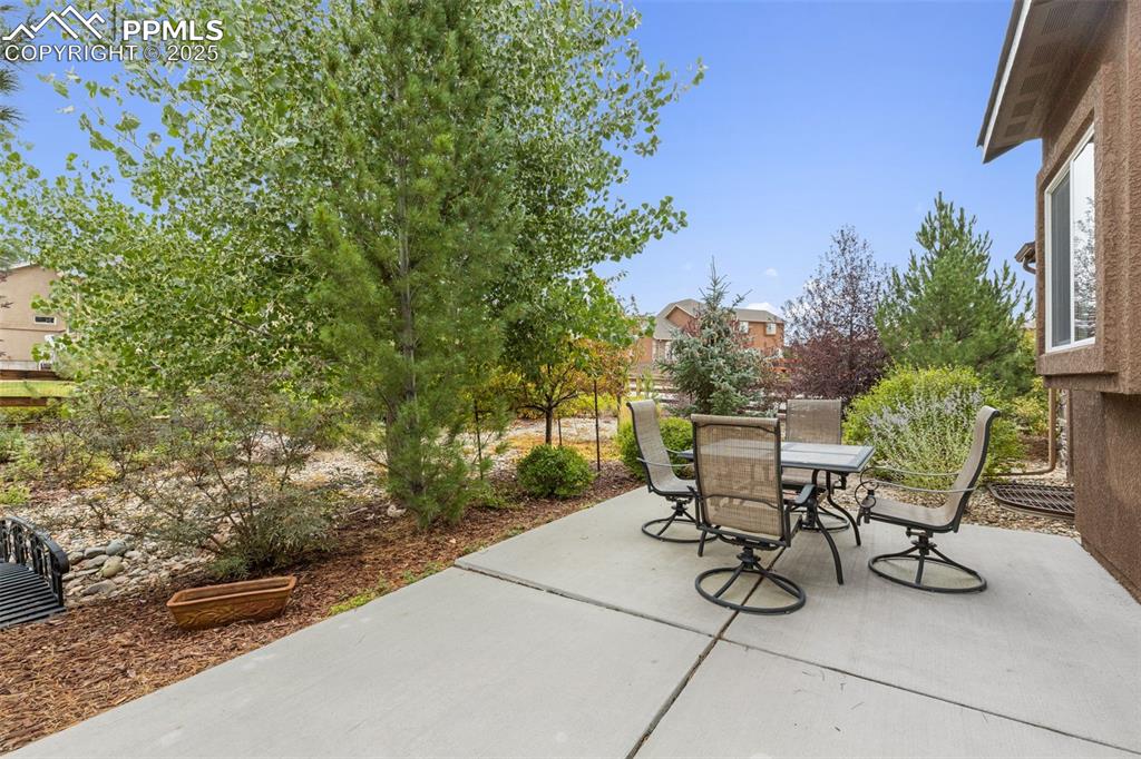 Image 34 of 50: View of patio featuring outdoor dining area