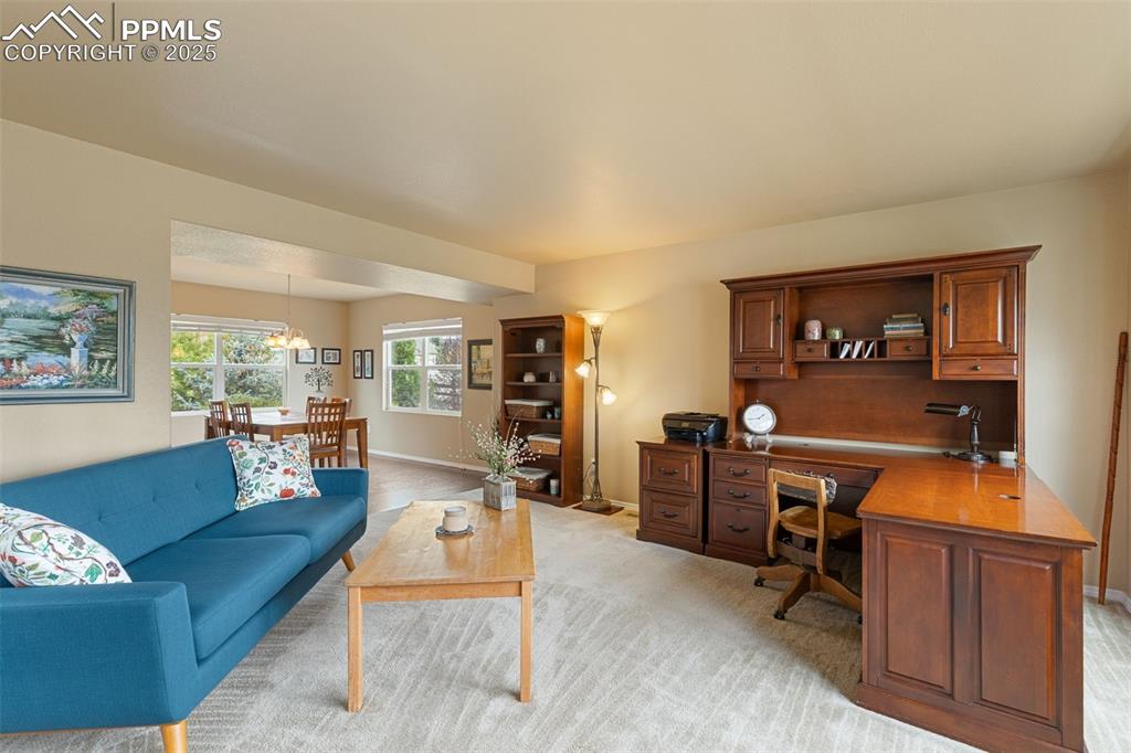 Image 8 of 50: Office area featuring light colored carpet and baseboards