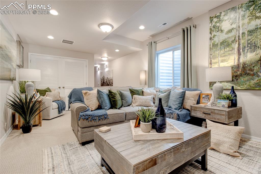 Image 26 of 30: Living area featuring recessed lighting