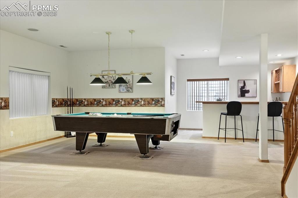 Image 29 of 50: Playroom with billiards table, light colored carpet, and recessed lighting