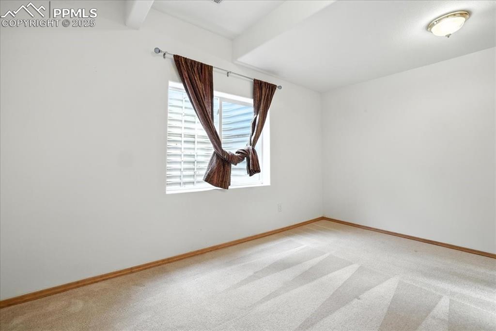 Image 35 of 50: Unfurnished room with light colored carpet and baseboards