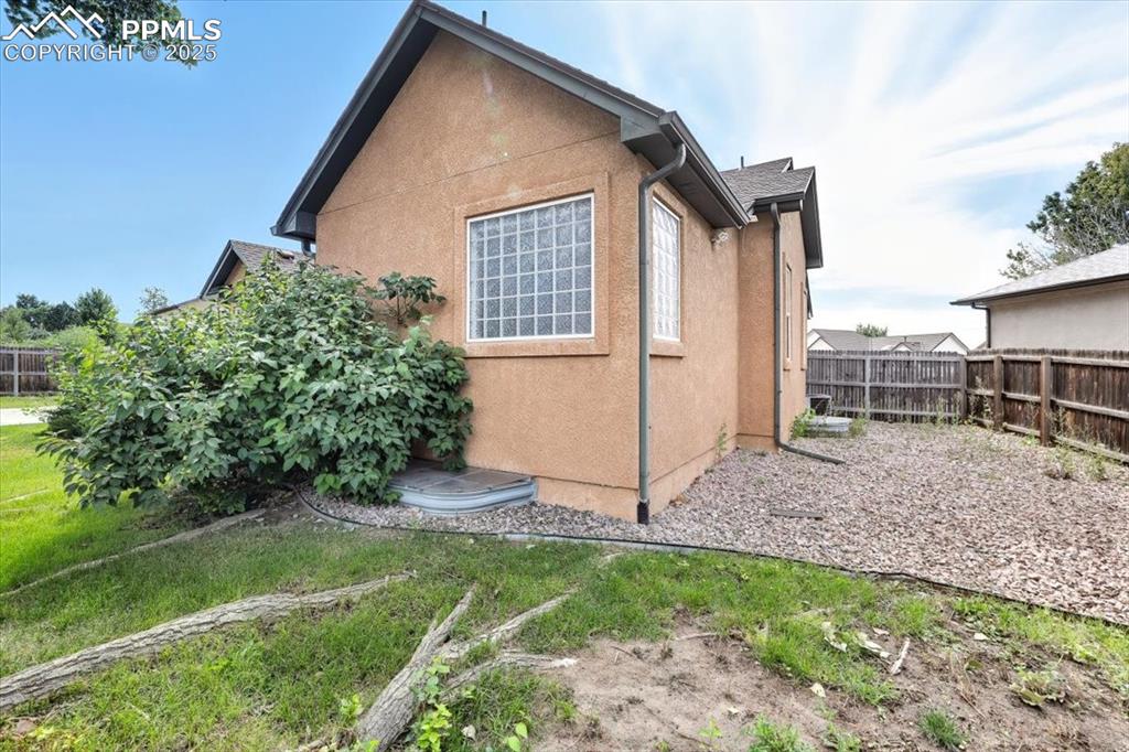 Image 49 of 50: View of property exterior featuring stucco siding