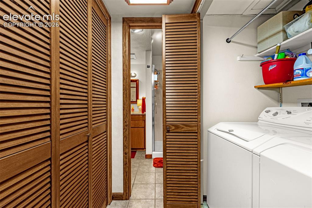 Image 24 of 42: Laundry closet with electrical room on other side of hall