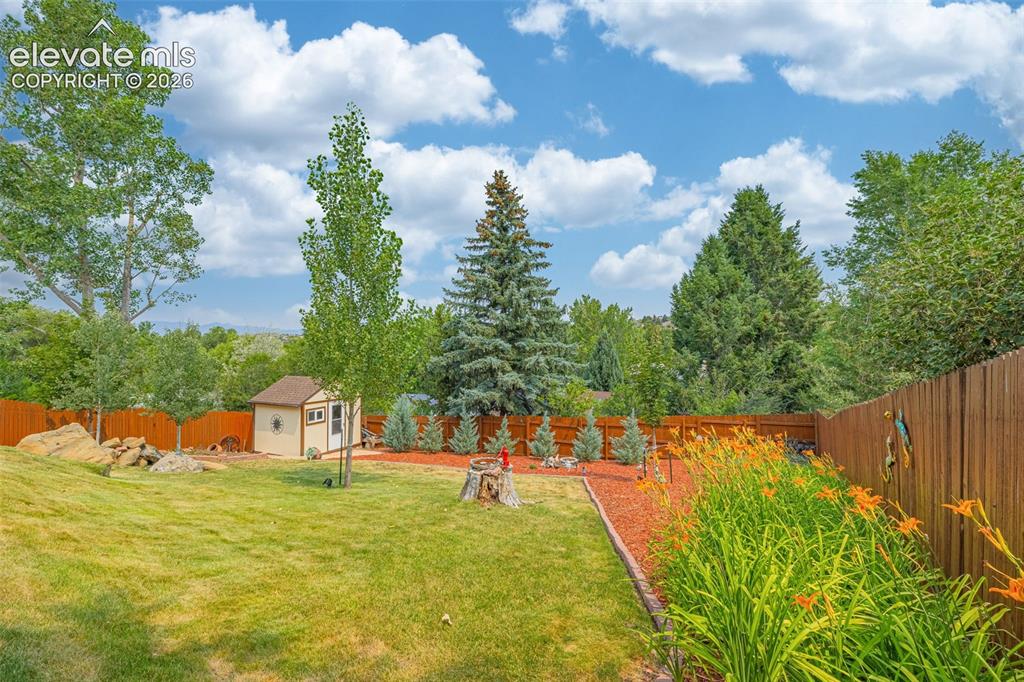 Image 31 of 42: Lower tier of backyard with second shed
