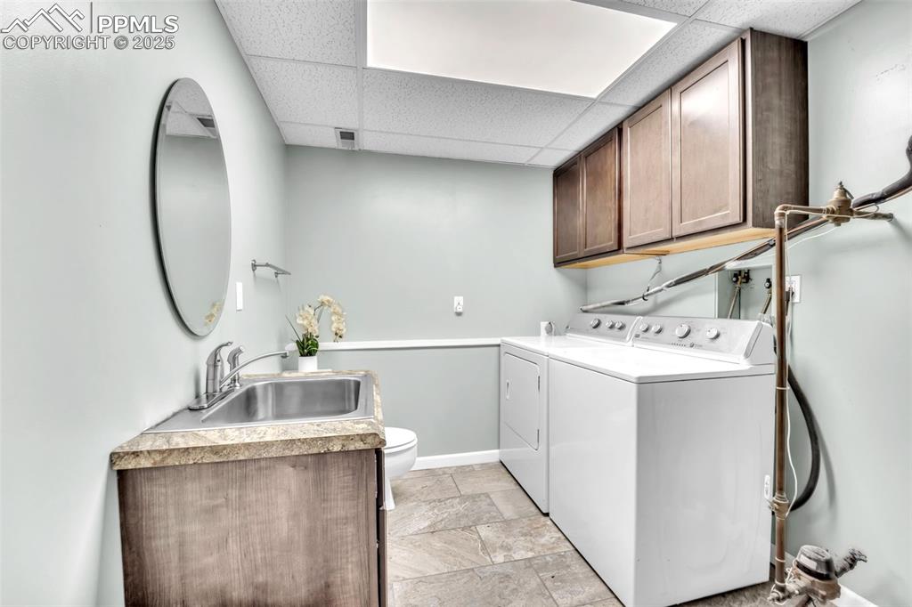 Image 22 of 34: Laundry and half bath.