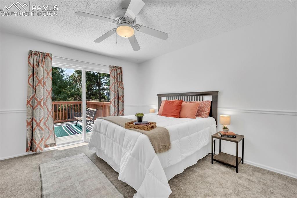 Image 7 of 34: Primary Bedroom is large and walks-out to back deck.