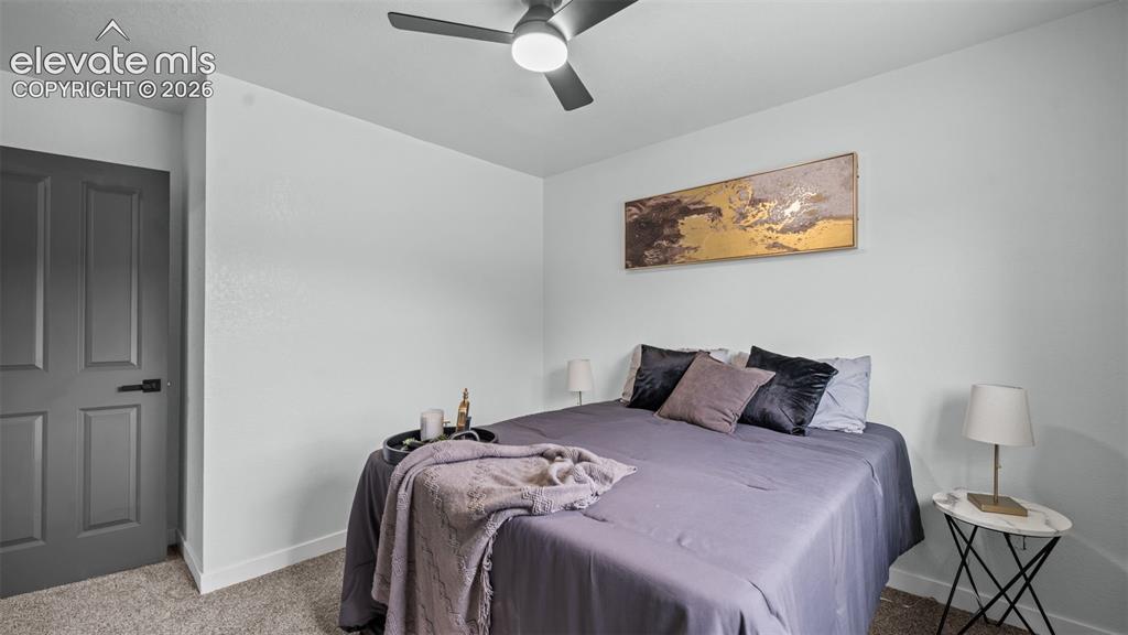 Image 17 of 31: Neutral wall color, ceiling fan with integrated lighting, paneled interior 