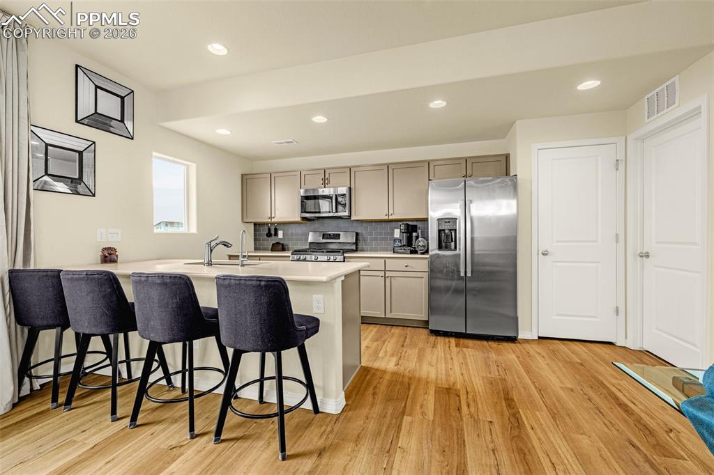 Image 10 of 33: Kitchen with Quarts countertops