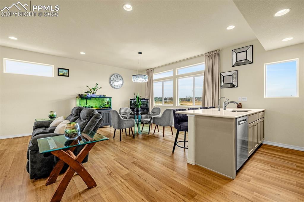 Image 12 of 33: Open Kitchen looking out to the family room and dining area