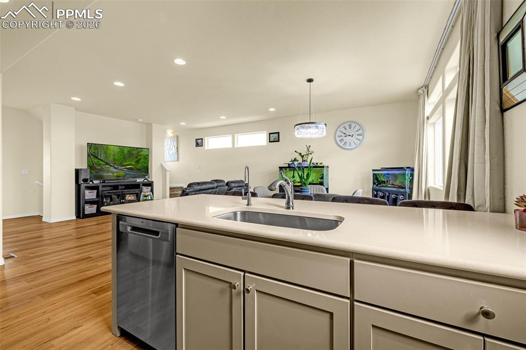Image 13 of 33: Open Kitchen looking out to the family room and dining area