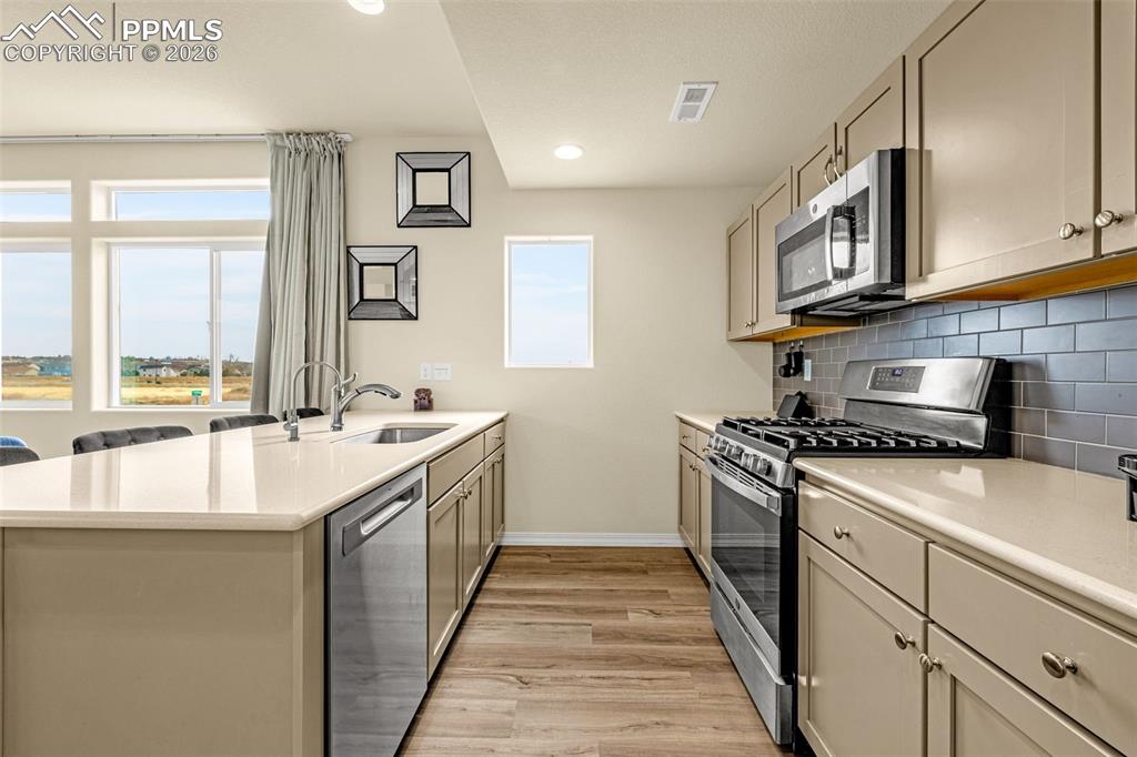 Image 14 of 33: kitchen comes fully equipped with all appliances to include gas range