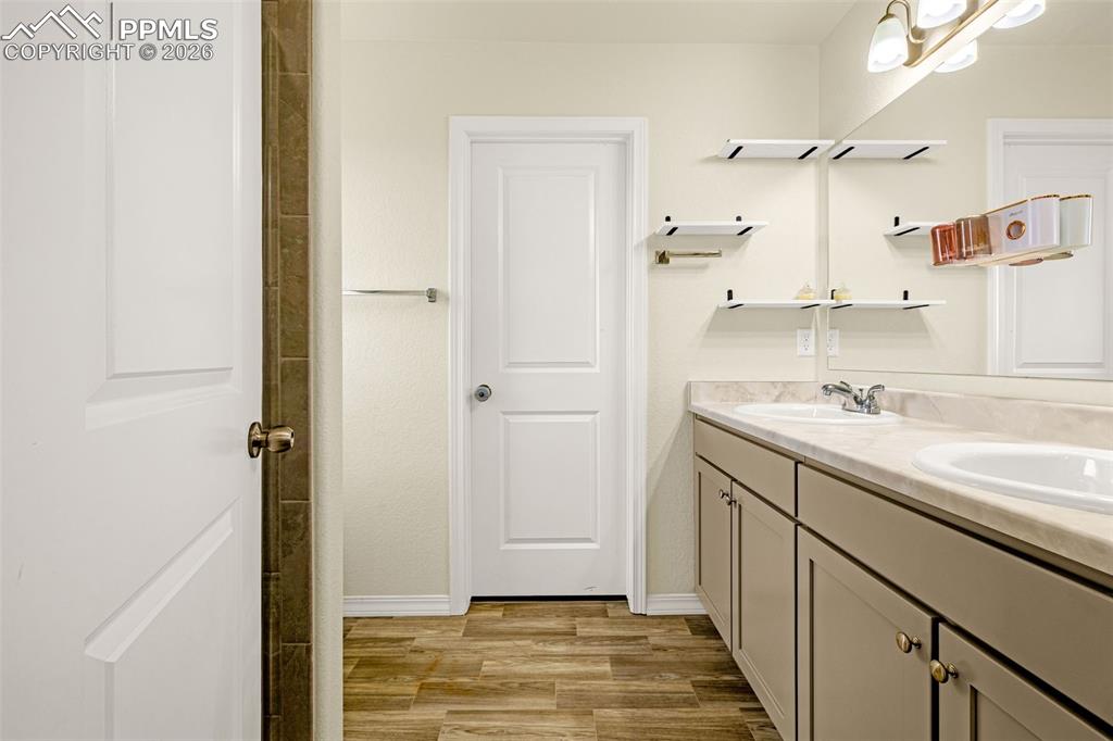 Image 19 of 33: Primary Bathroom connected to the bedroom includes a walk in closet