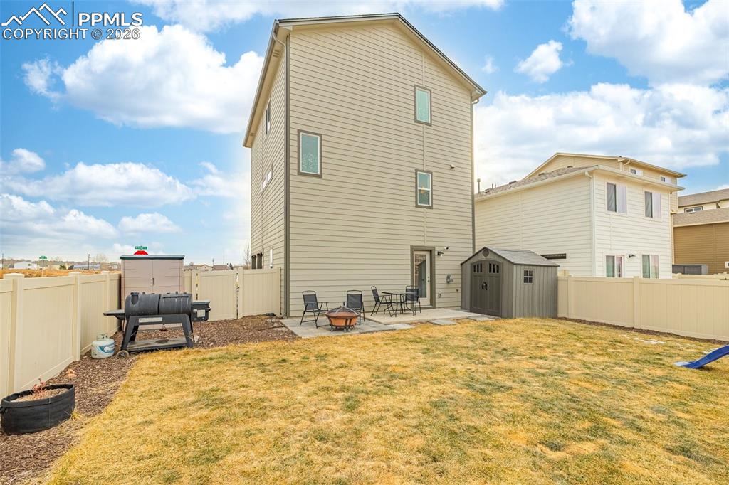 Image 28 of 33: Spacious back yard with grass and mountain views