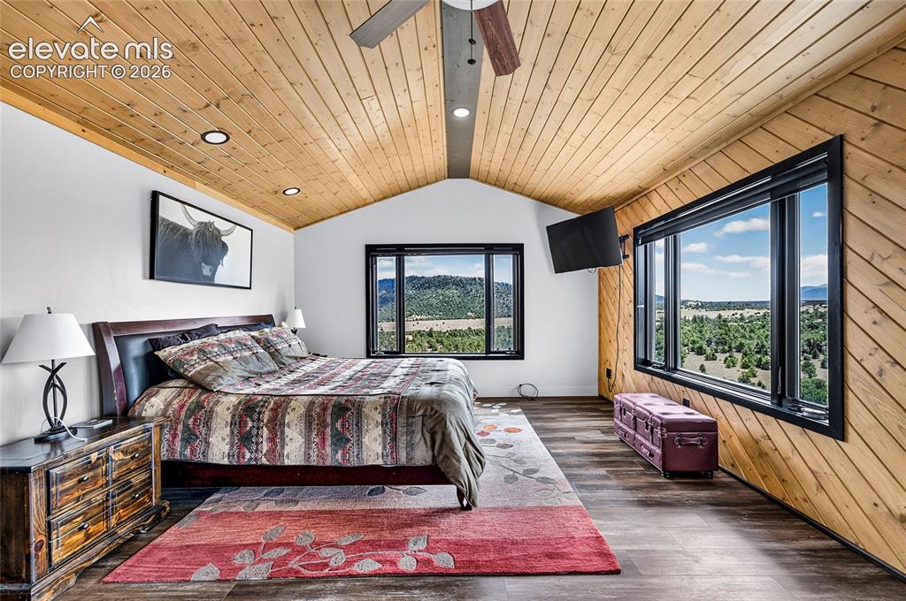 Image 13 of 45: Vaulted wood-paneled ceiling with recessed lighting, wood-finish flooring,