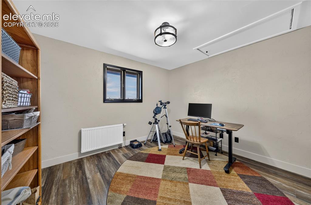 Image 17 of 45: Wood-finish flooring with neutral wall tones