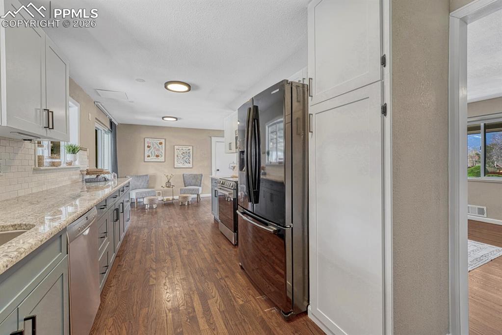 Image 12 of 50: Wood floors throughout the main level.