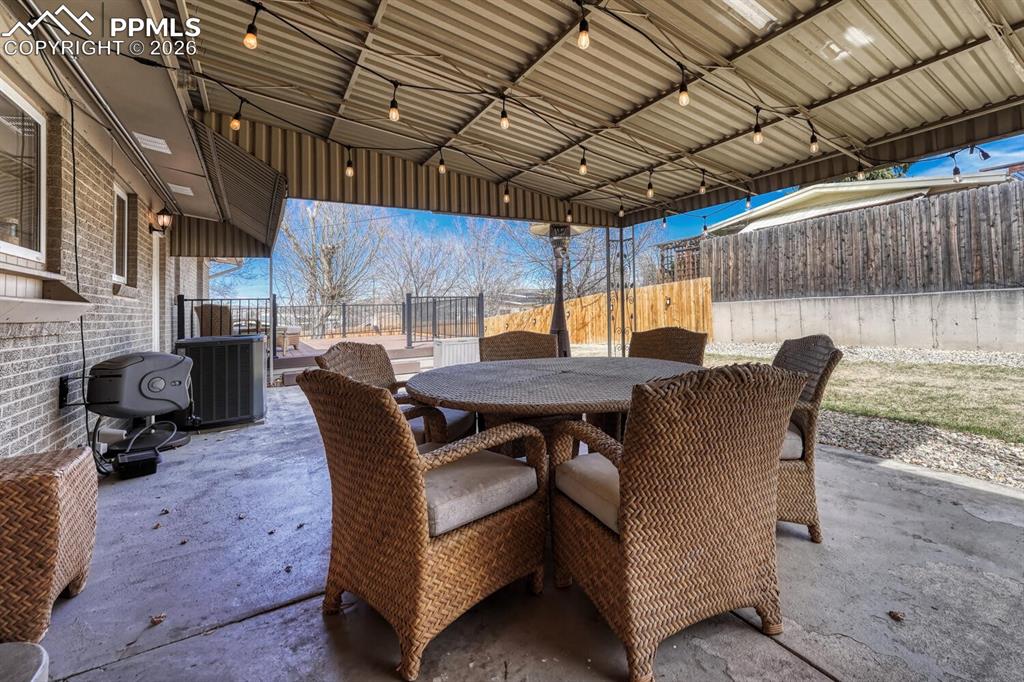 Image 14 of 50: Covered patio off kitchen