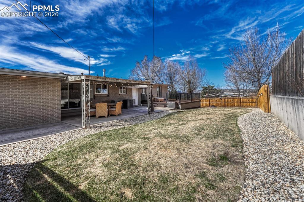 Image 17 of 50: Large grassy yard to play on.