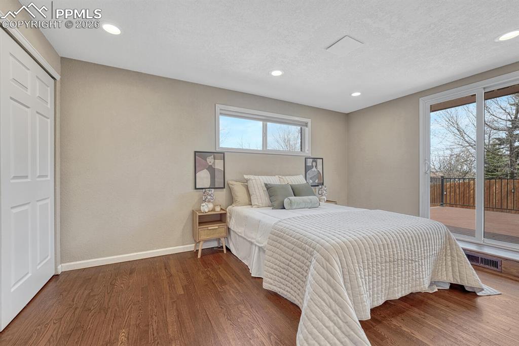 Image 22 of 50: Main level primary bedroom.