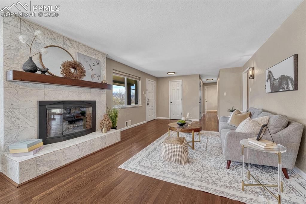 Image 3 of 50: Stunning wood burning fireplace.