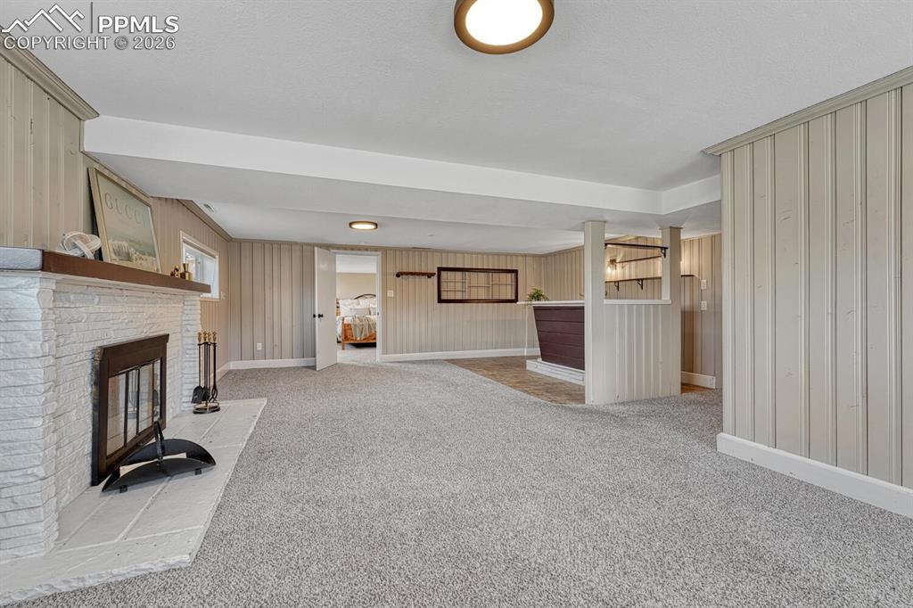 Image 34 of 50: Great sunny family room with wet bar!